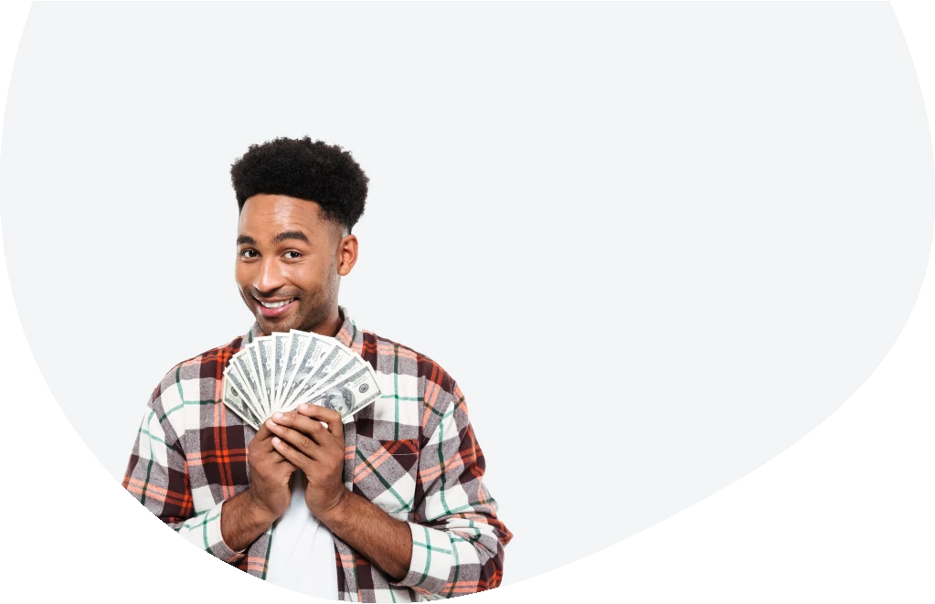 Smiling man showing the money received from $800 loan