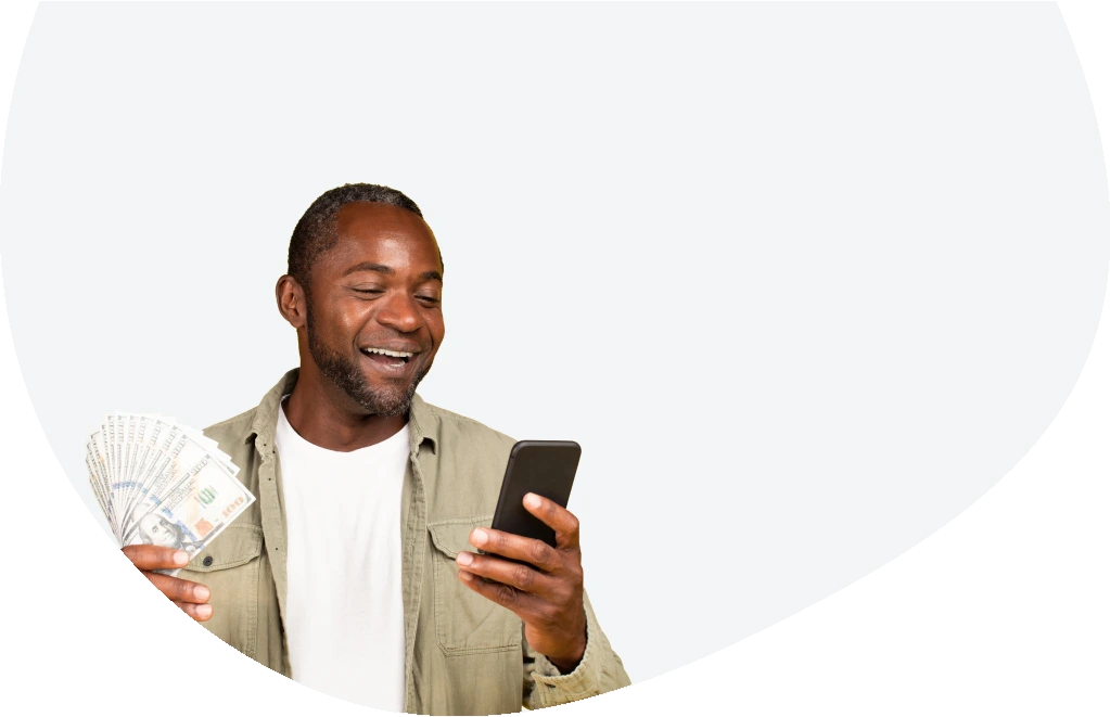 Happy man holding the money received from an installment loan 