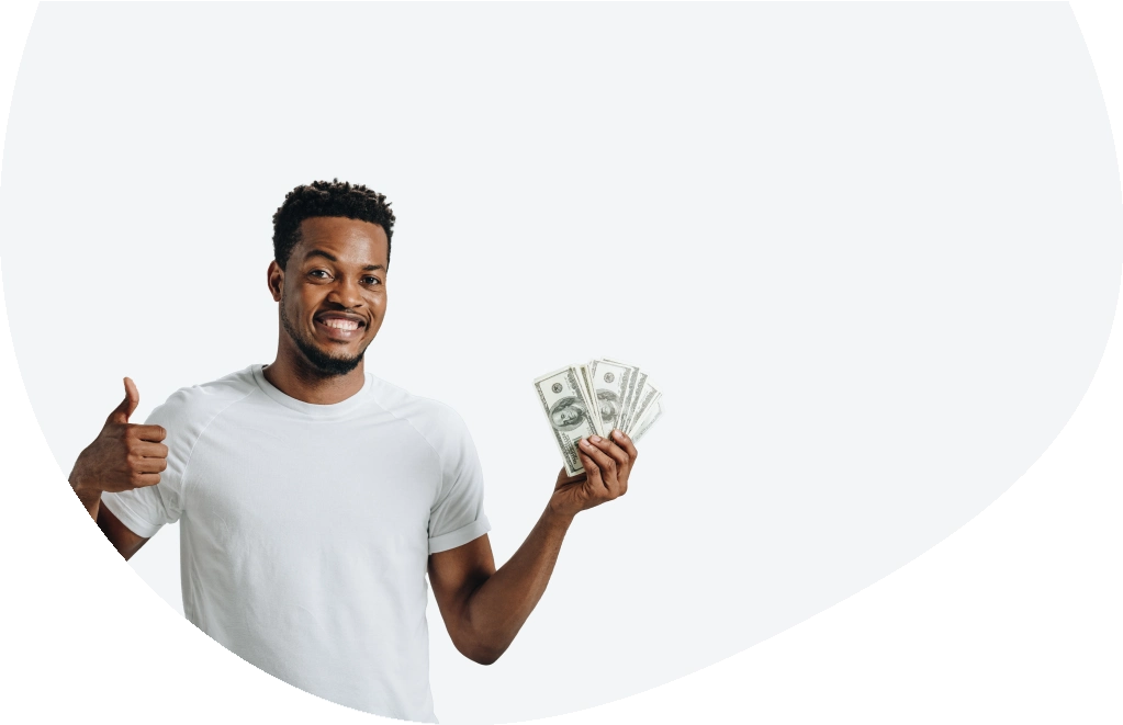 Young man holding cash received from a second chance loan